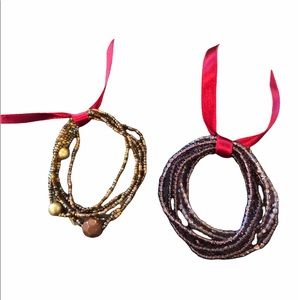 Two sets of beaded bracelets, purple and gold